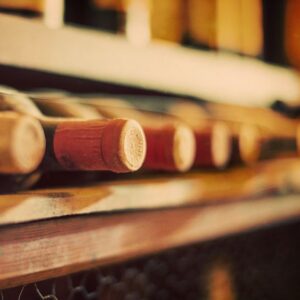 closeup of the necks of wine bottles