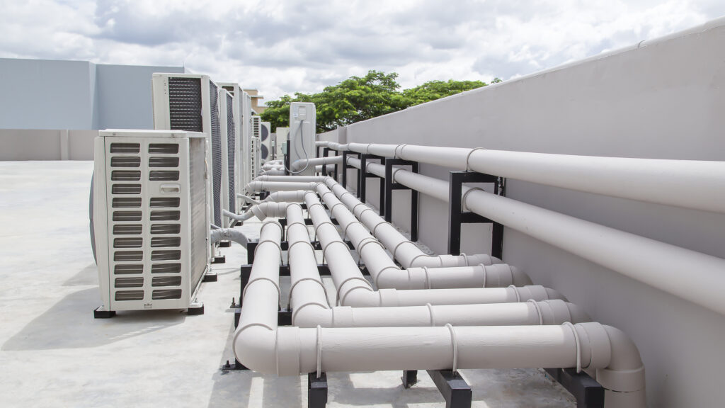 Air conditioning (HVAC) installed on the roof of industrial buildings. stock photo