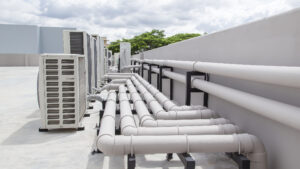 Air conditioning (HVAC) installed on the roof of industrial buildings. stock photo